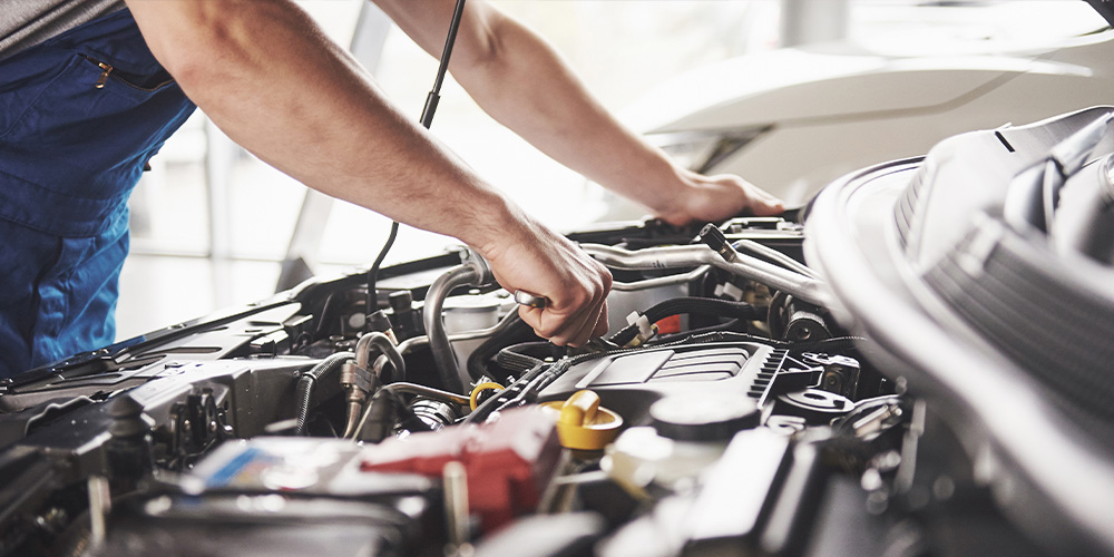 Image of mechanic fixing the engine